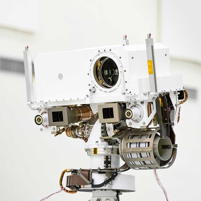 A white box with a lense on the right end with complex equipment on the underside; a sensor bound for Mars