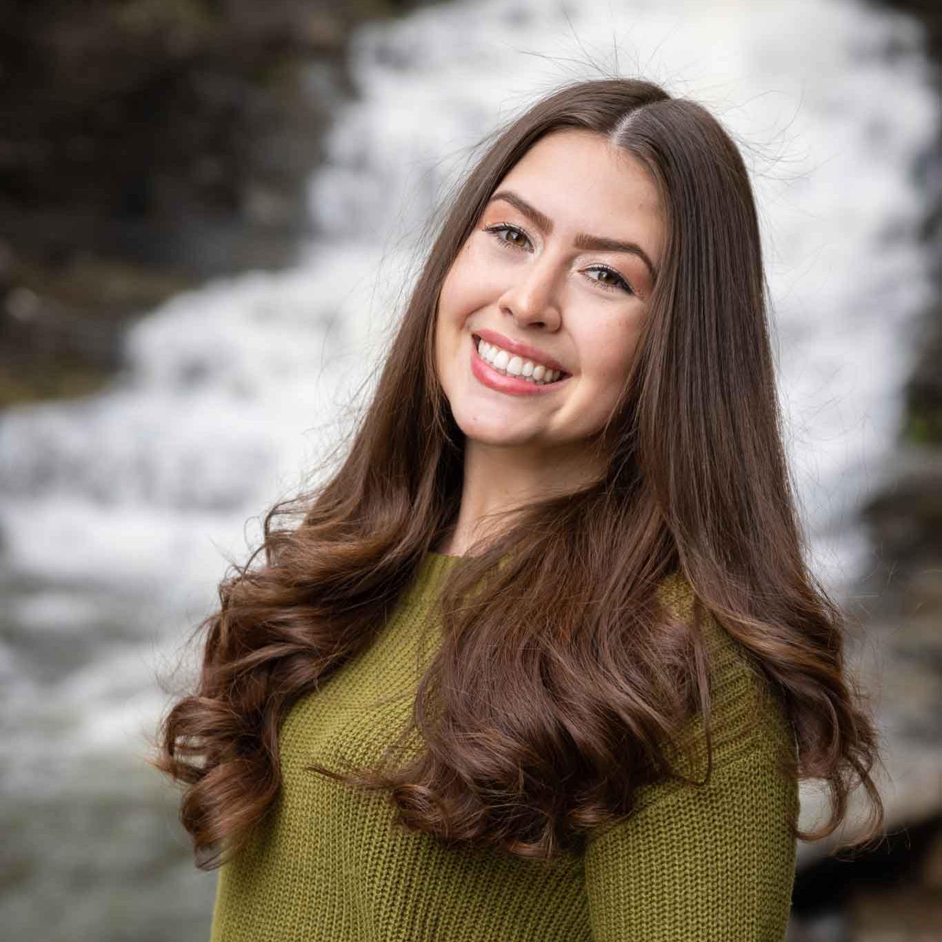woman in front of waterfall