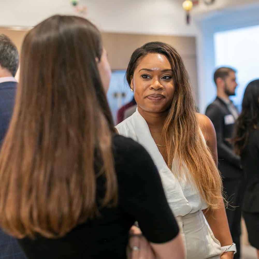 		three people talking
	