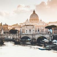 Rome at sunrise: Cathedral dome in the distance, bridge in the foreground
