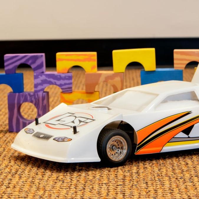 		Toy car in front of colored blocks
	