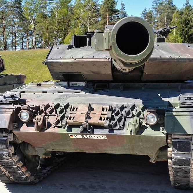 A military tank up close, with a view directly into the muzzle of its gun