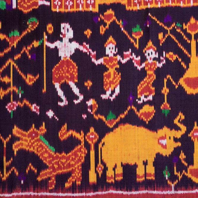 		Detail of a woven cloth showing figures dressed in red and yellow
	