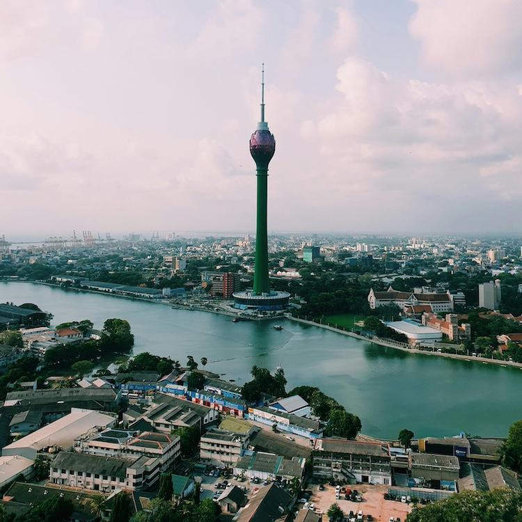 		A city at midday with a tower 
	