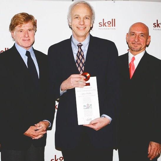 Three people wearing suits