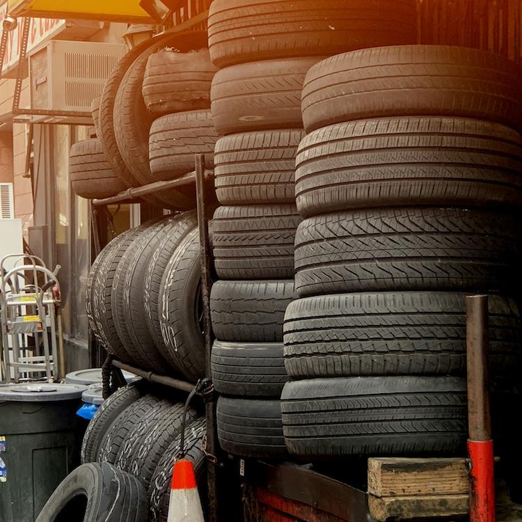 		Tall stacks of old car tires
	