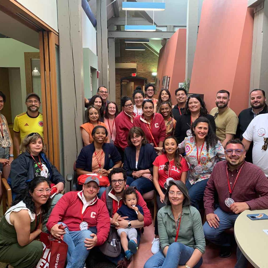 a bunch of people in a group smiling