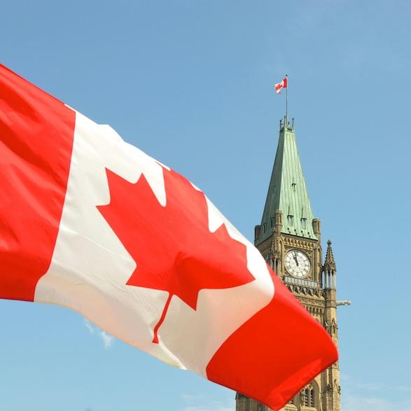 		Canada's red and white flag with Ottawa's Peace Tower in the background
	