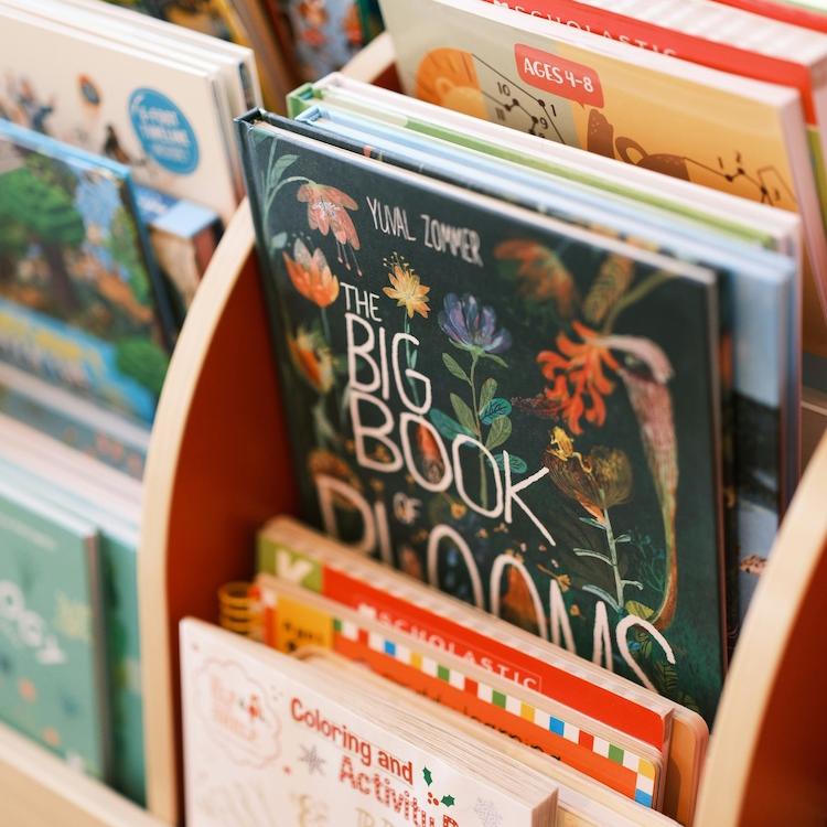 Colorful picture books in a bin