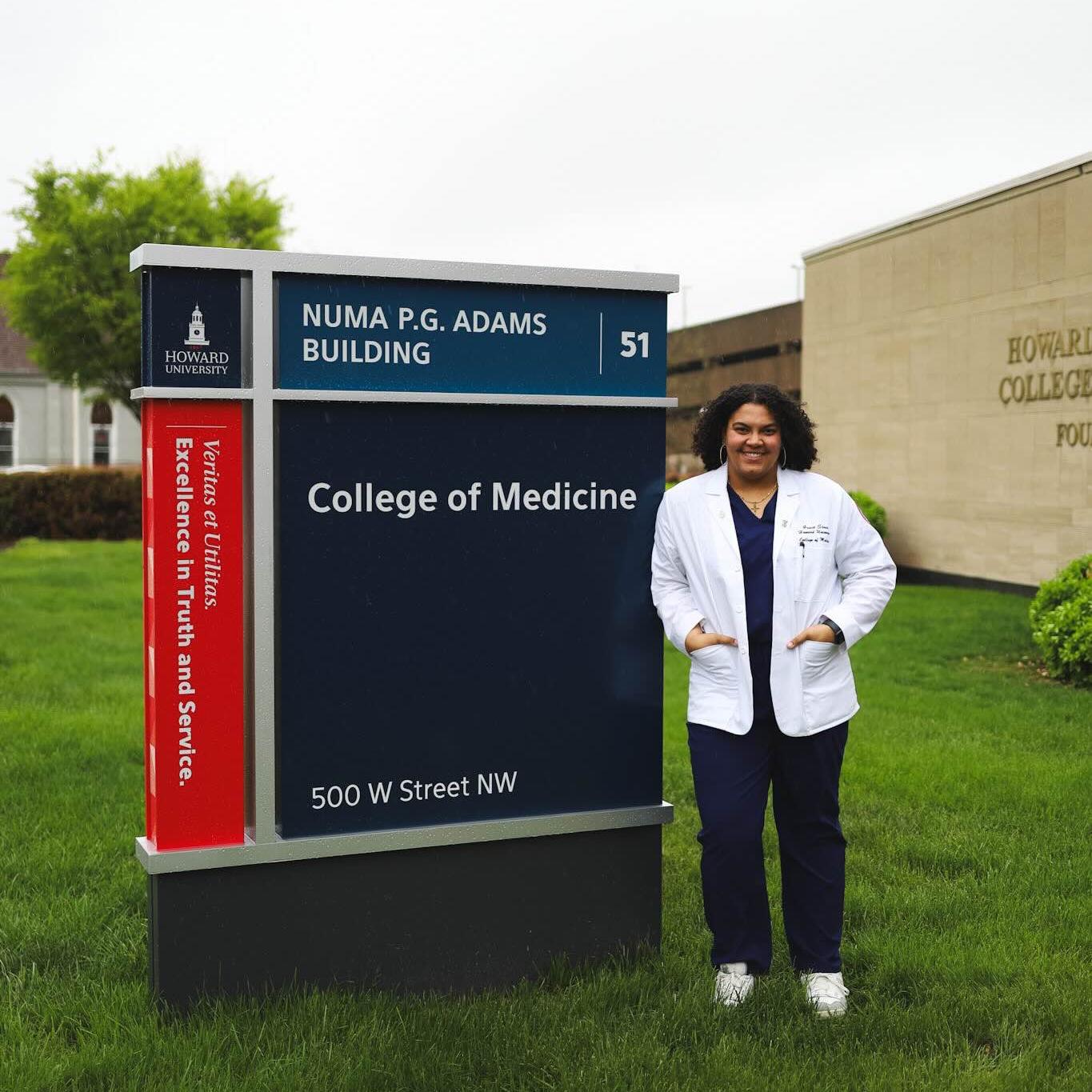 		person outside medical school building
	
