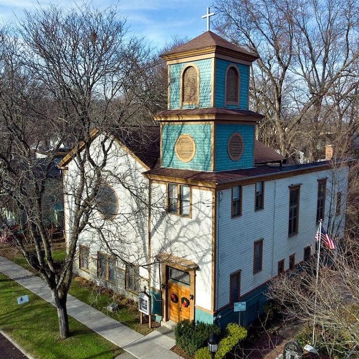 		church building with a green-blue bell tower
	
