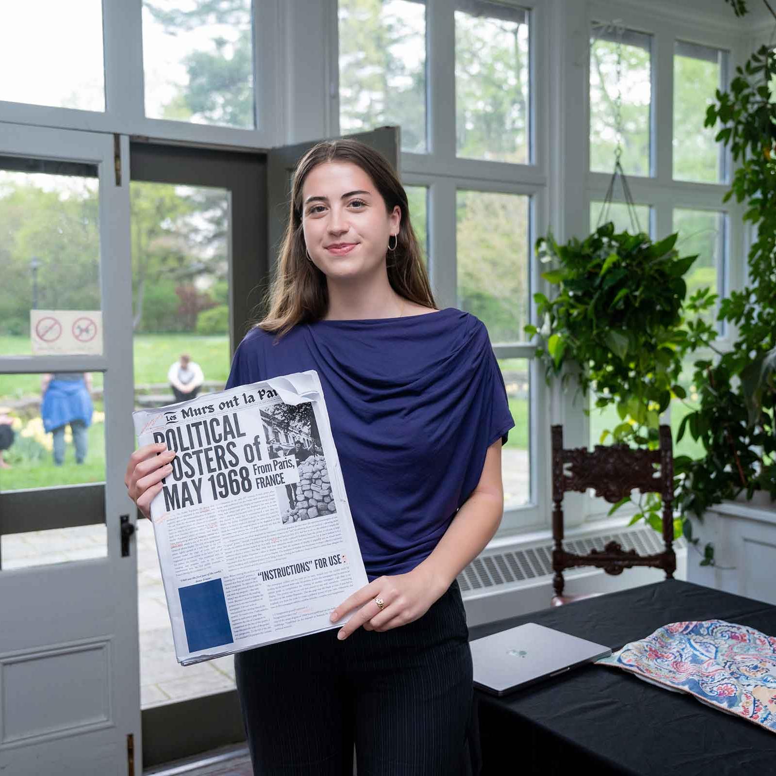 		person holding newspaper
	