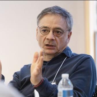 		Older man with glasses and gray hair talking with his hands.
	