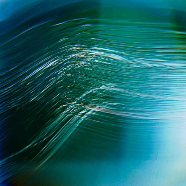 		Abstract image in blue and green with lines running in parallel
	