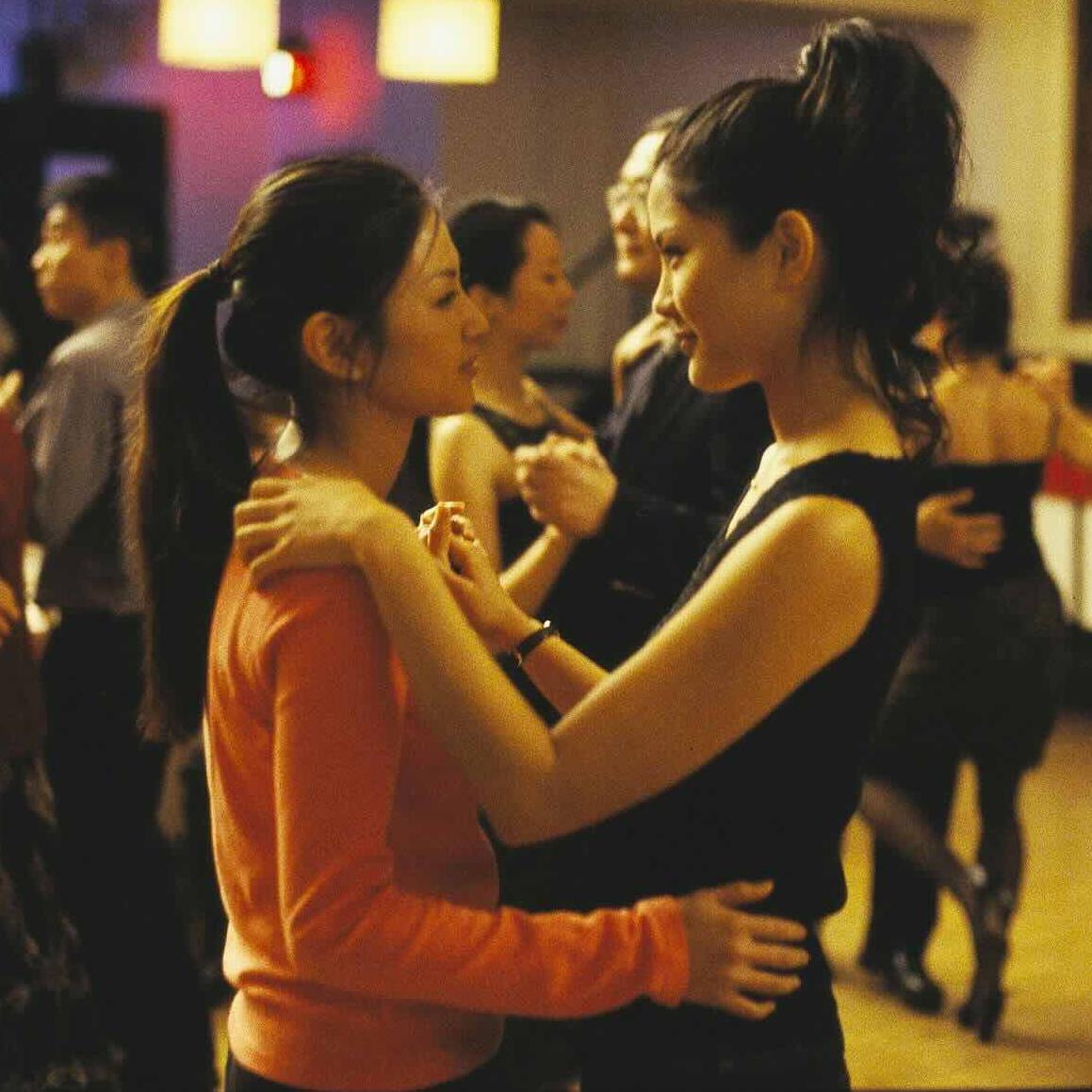 		two women dancing
	
