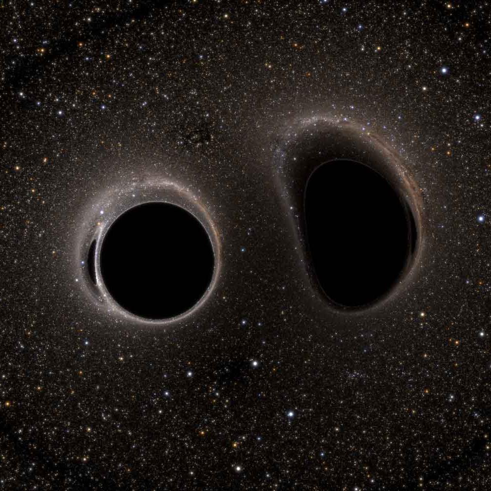 		A field of stars surrounding one circular and one oblong area of extreme blackness surrounded by a halo of light
	