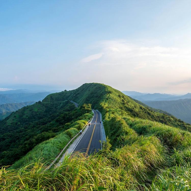 Grassy hill with a road leading up it: Scene from Taiwan