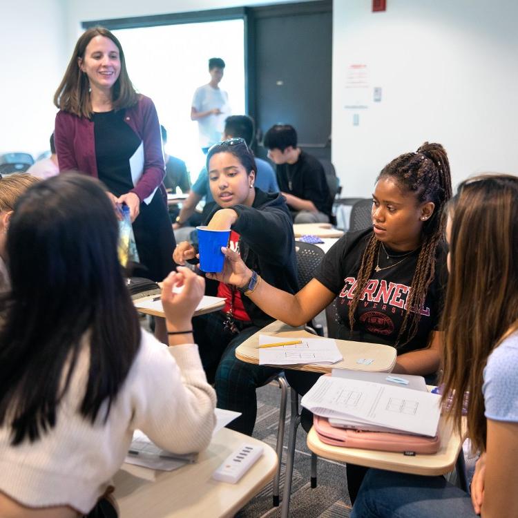		professor and students in a classroom
	