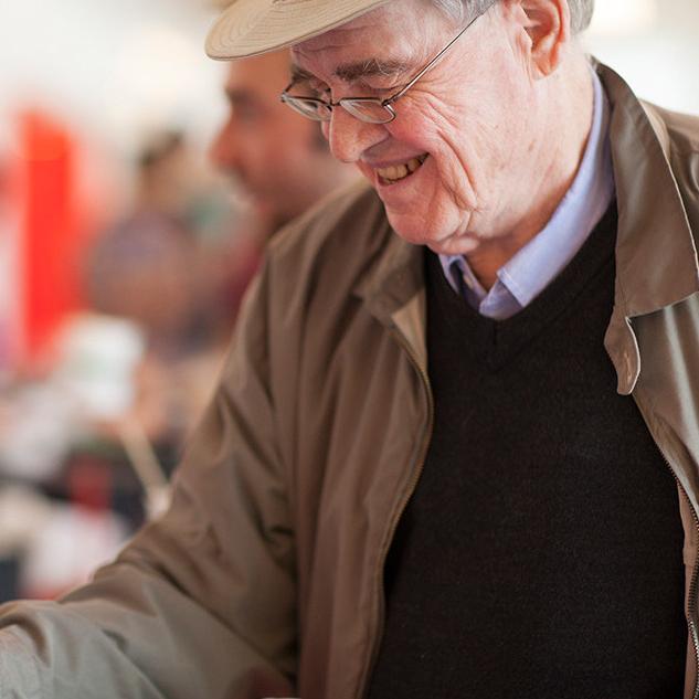 		Person smiling down at a cup of ice cream
	