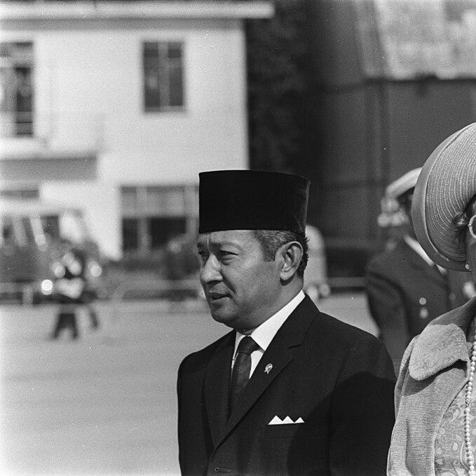 		Black and white photo from 1970 of two dignitaries in an outdoor event
	