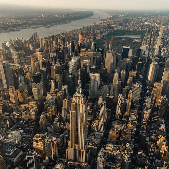 Sky scrapers rise from New York City in an aeriel shot
