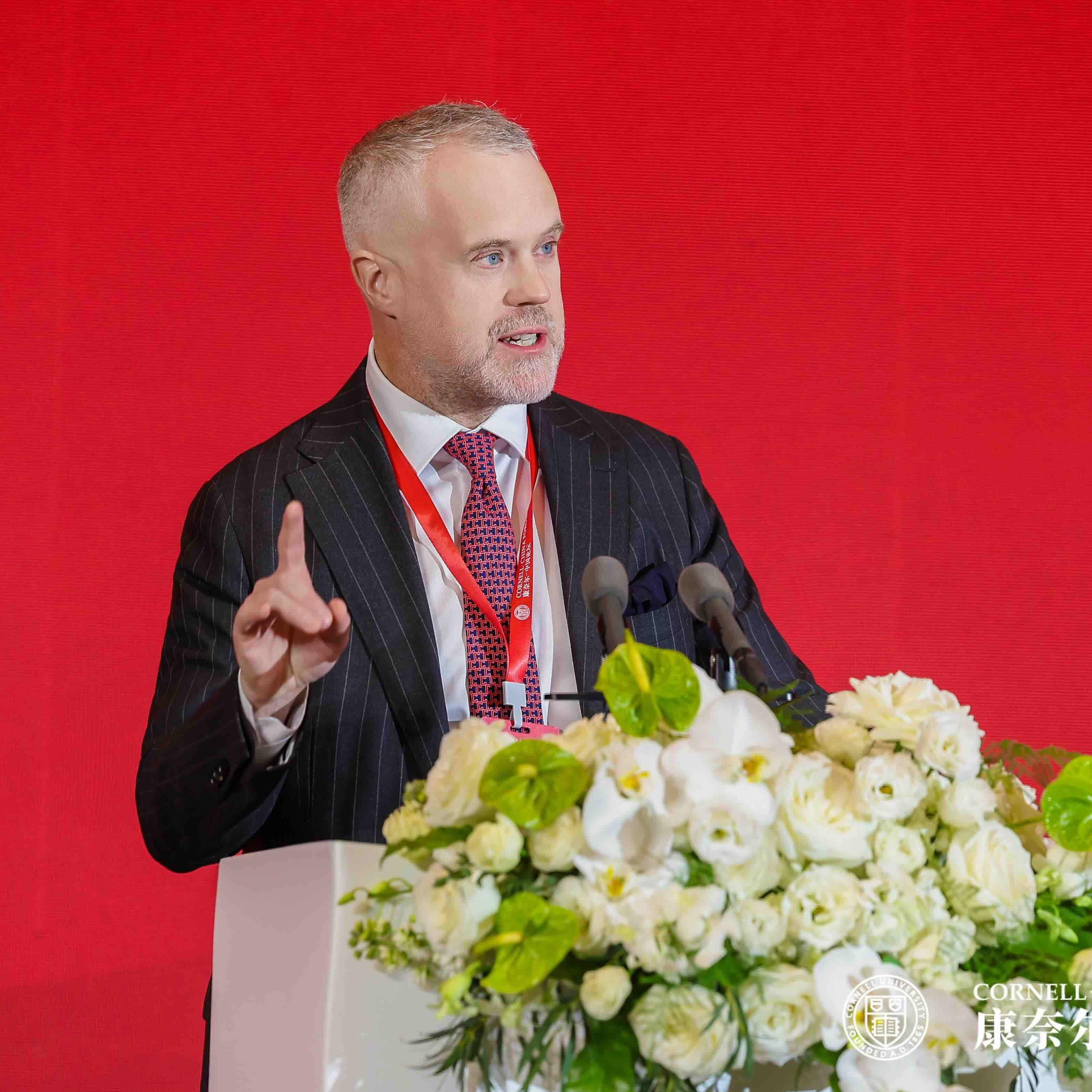 man speaking at a podium