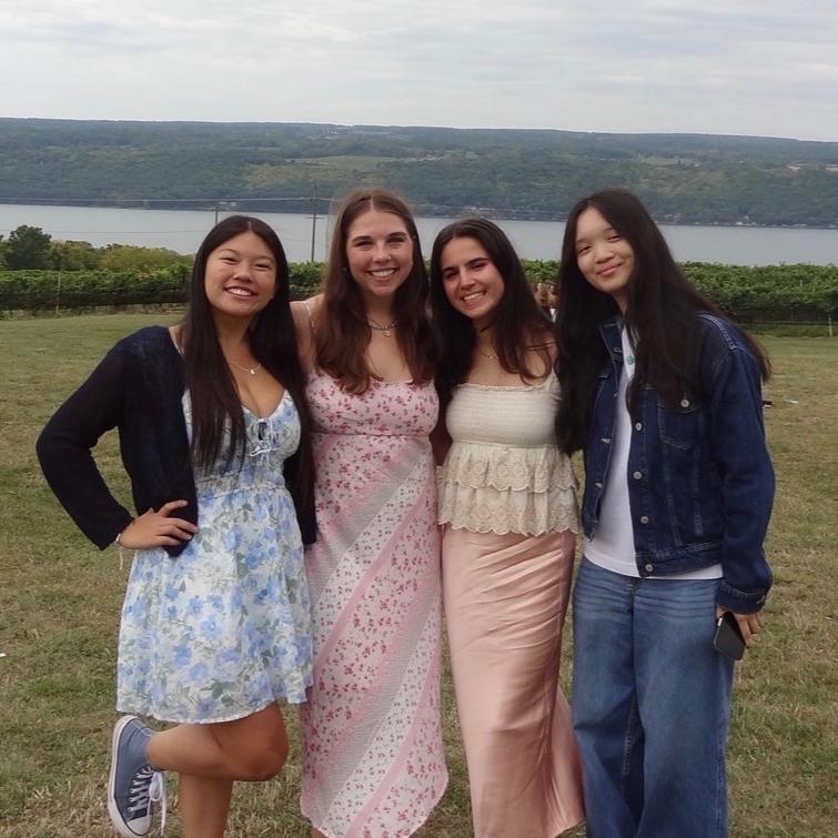 group of students with lake in background