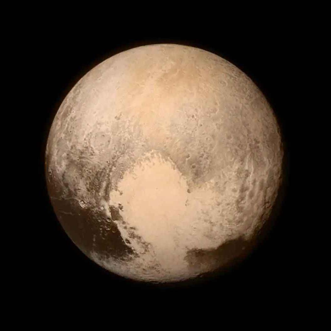 An image of Pluto showing the outline of a heart.