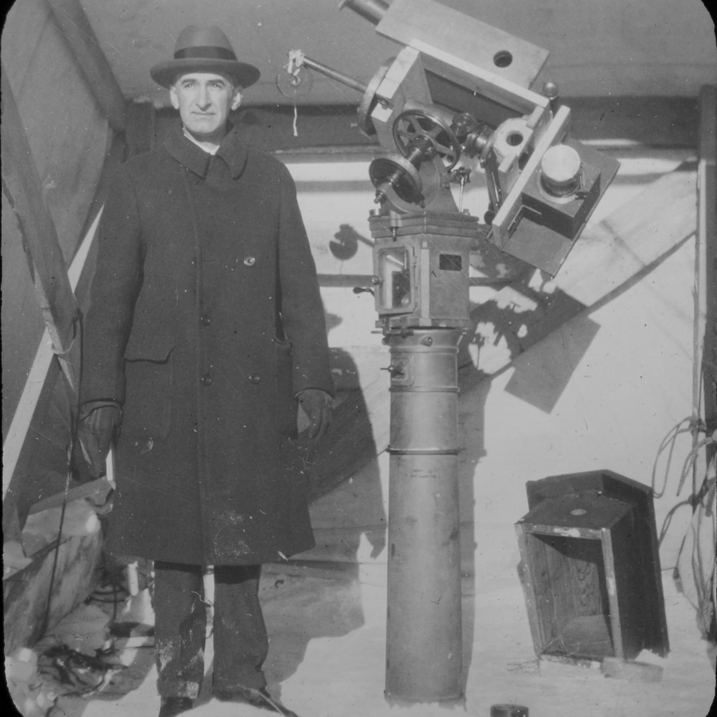 		person standing outside with spectrograph
	