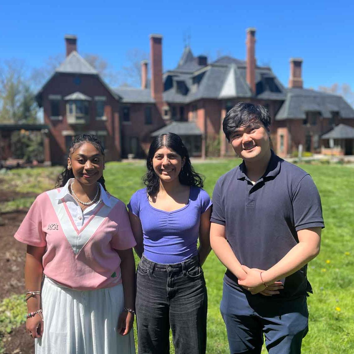 three people standing outside