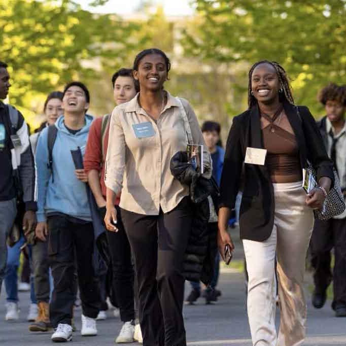 a group of people walking outside