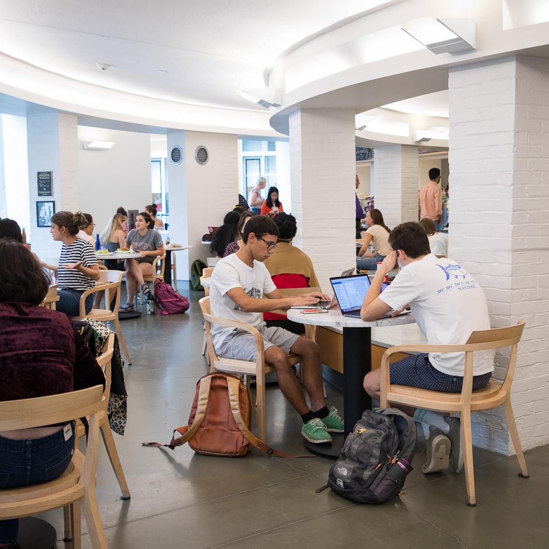 		people eating in a cafe
	