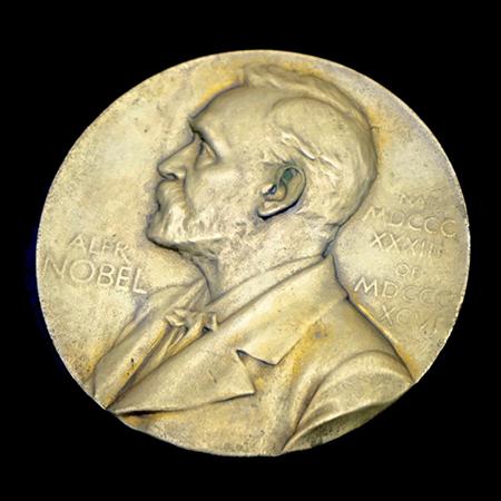 		The Nobel Prize as a Gold medal on black background
	