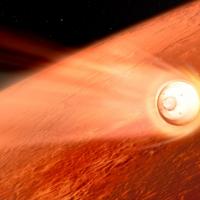capsule approaches a red planet
