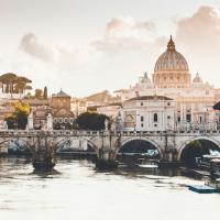 Rome at sunrise: Cathedral dome in the distance, bridge in the foreground