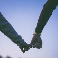  Two people holding hands