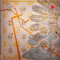  Quilt depicting orange lines and slave ships in a half circle facing out