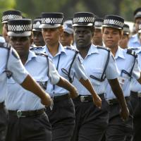  Royal Solomon Islands Police Force female officers march down the main street of Honiara on International Women’s Day, 8 March 2010