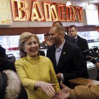  Hillary Clinton shaking hands in bakery