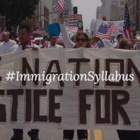  Protesters holding banner saying &quot;Immigration Syllabus&quot;