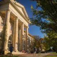  Students walk past Goldwin Smith Hall in the fall