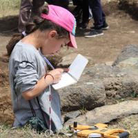 Camper Mary draws an excavation trench at Gegharot, an archaeological site in Armenia.