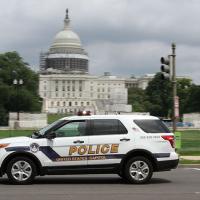  Police vehicle in front of U.S. Capitol building