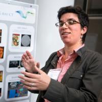 Teresa Porri, CT manager for Cornell’s Institute of Biotechnology, discusses her poster illustrating the Biotechnology Resource Center’s Imaging Facilities
