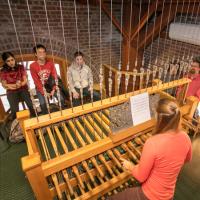  Students watch as their chimes compositions are played