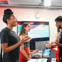  Students from Blackstone LaunchPad explain their resources during an entrepreneurship fair