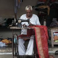  A woman sewing in India