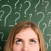  Woman&#039;s face surrounded by question marks