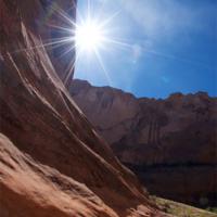  Image of a canyon in Utah with the sun shining down