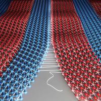  Two patches of crystals are seamlessly &quot;sewn&quot; together to create atomically-thin fabrics.